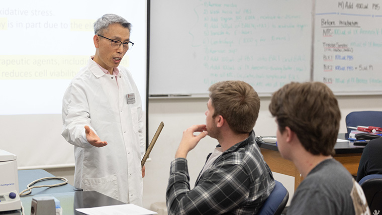 Biology department head Dr. Kyoungtae Kim teaching a lab class.