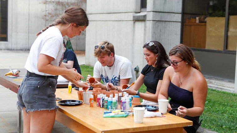 A small group of STEM LLC students doing arts and crafts during move-in weekend.